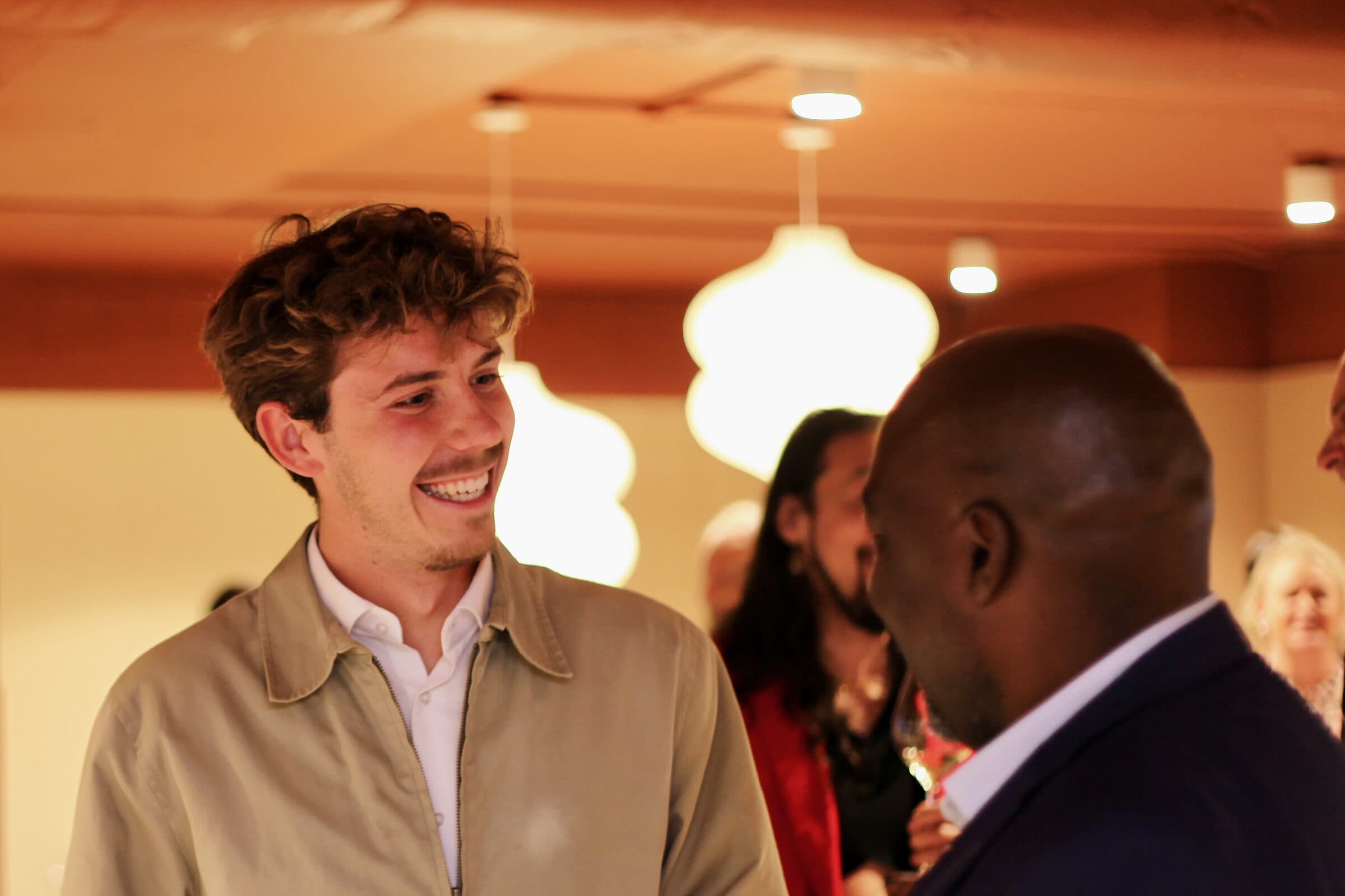 Founders laughing in conversation at Workspace by black vc