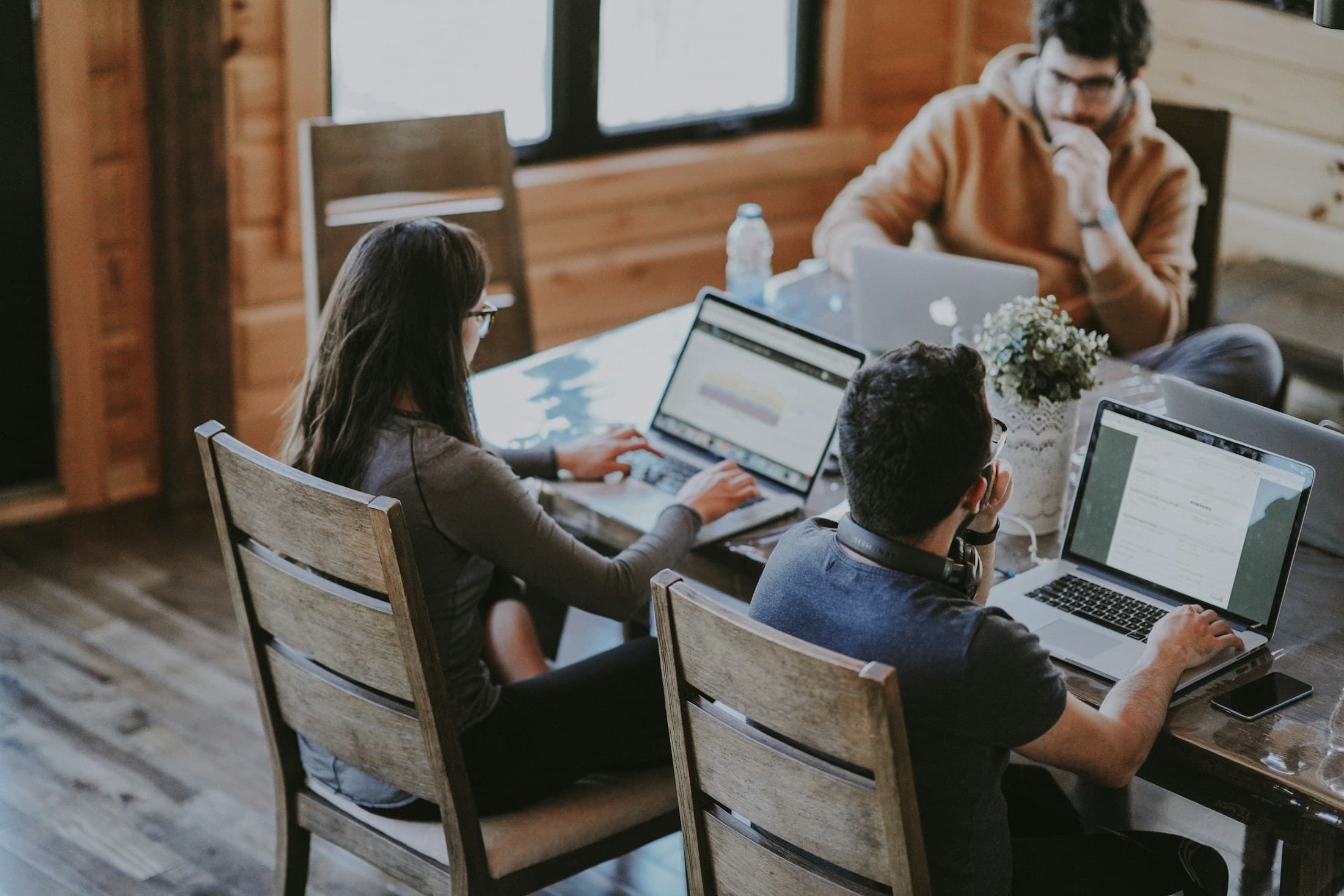 A small team working together around laptops