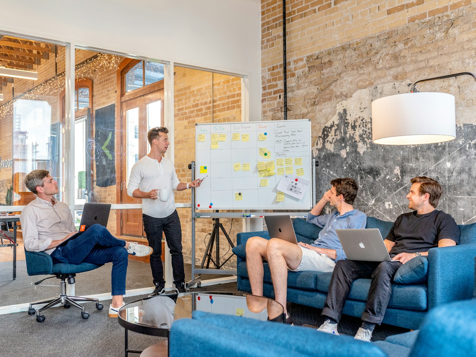 People testing ideas around a whiteboard