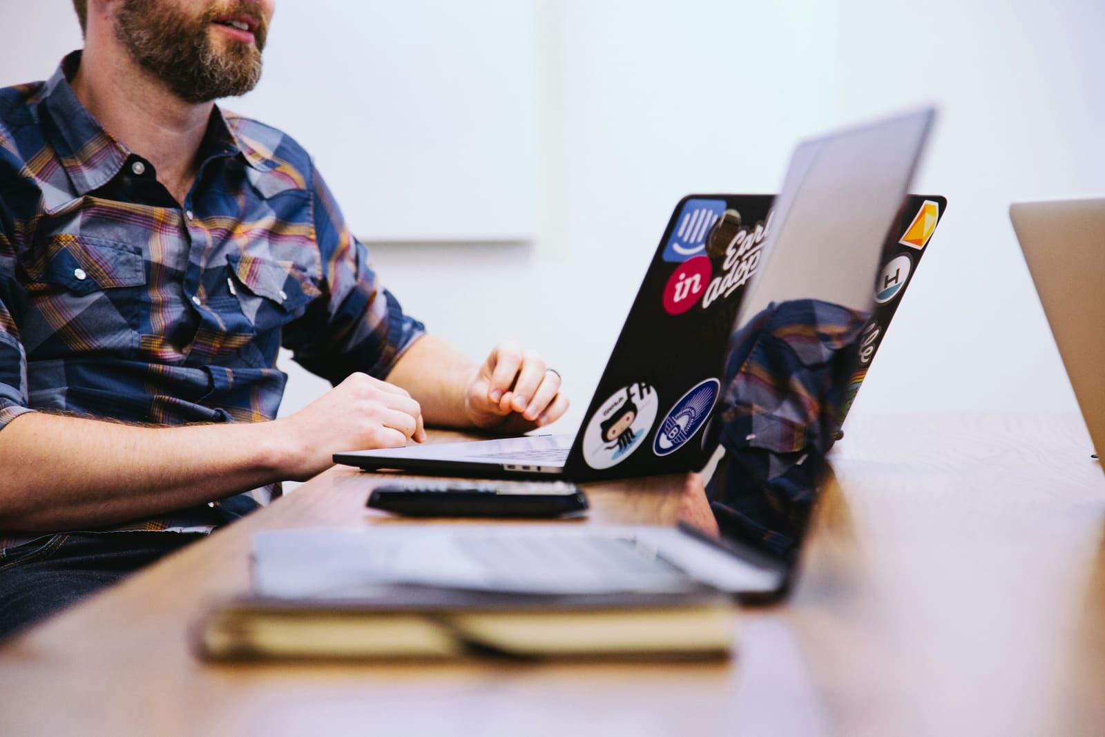 A founder working at a laptop in a startup office
